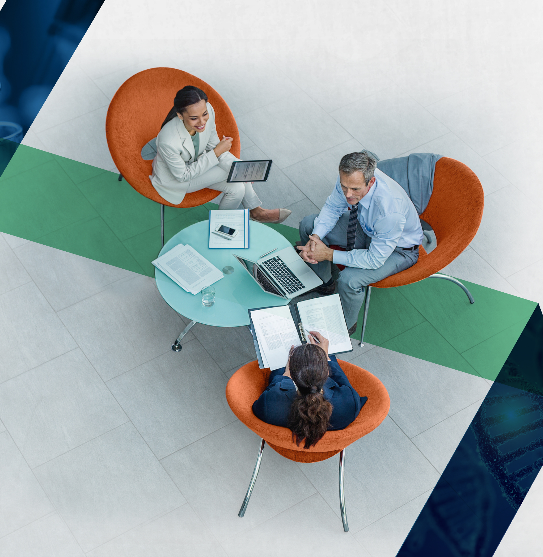 A group of professionals sit at a small circular table.