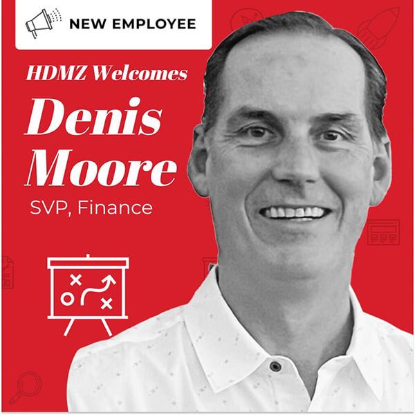 A headshot of Denis Moore, SVP of Finance at HDMZ.