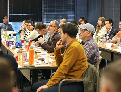 A group of HDMZers sitting in a conference room.