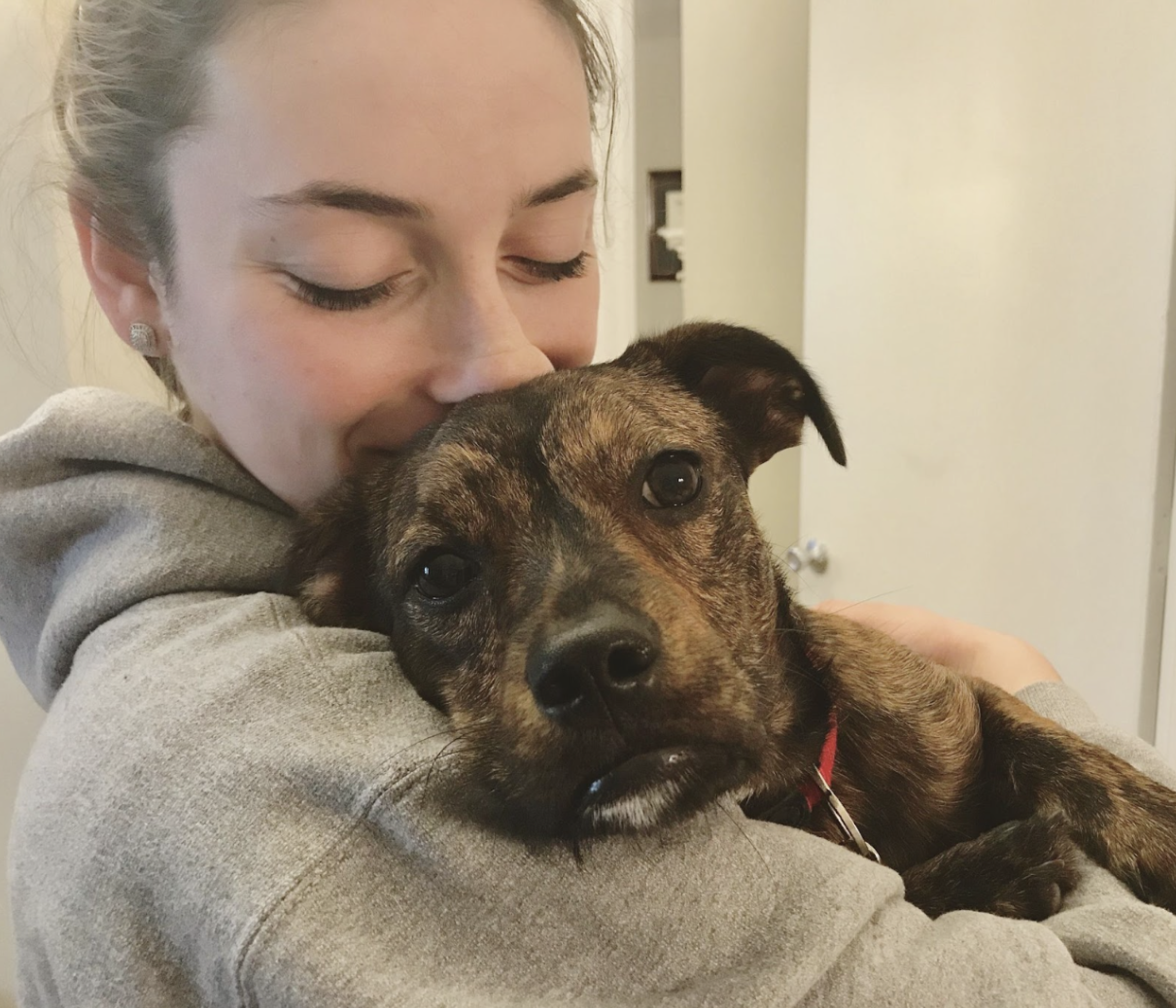 Employee holding her dog