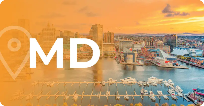 An aerial view of the Baltimore Inner Harbor at sunset, with the letters "MD" overlaid, signifying Maryland.